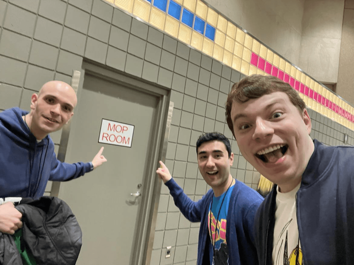 Friends pointing at the legendary Mop Room