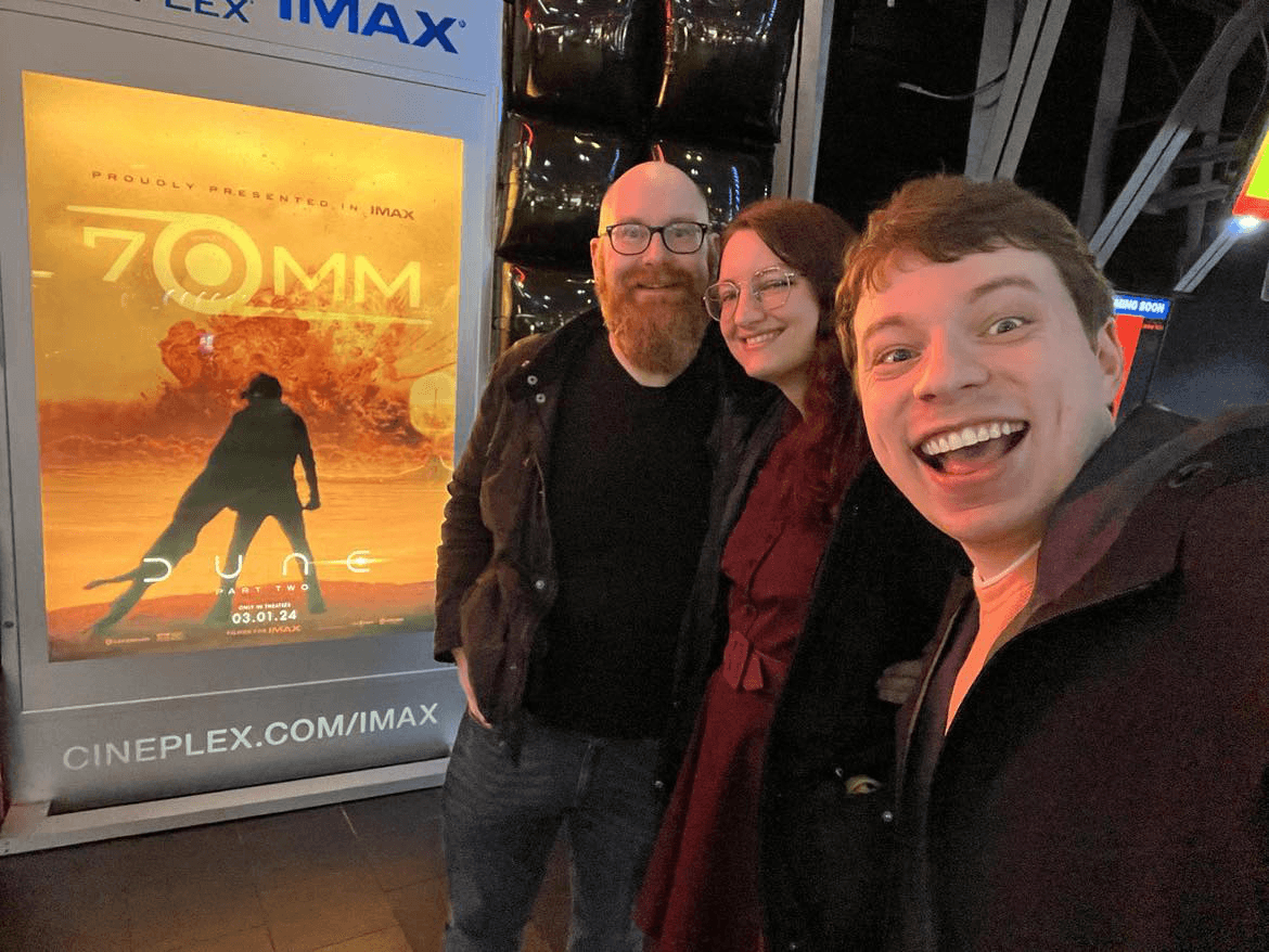 Selfie of friends with IMAX Dune 2 poster