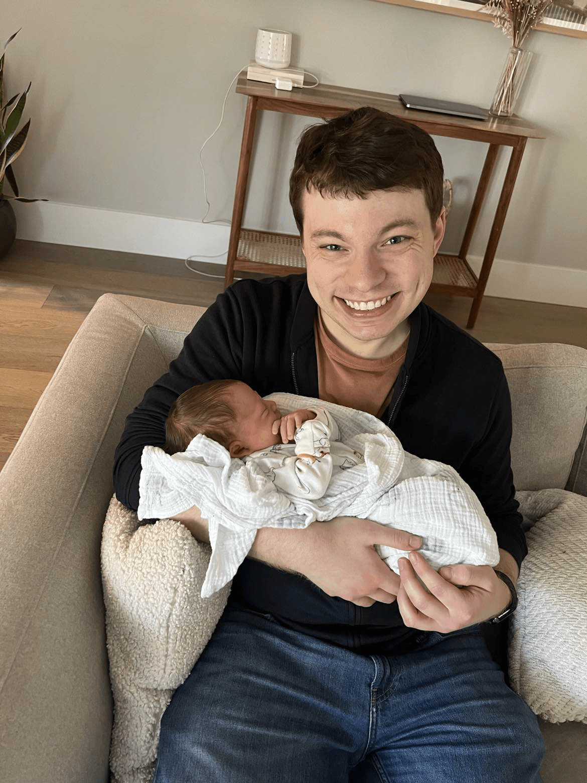 Josh holding newborn Carter