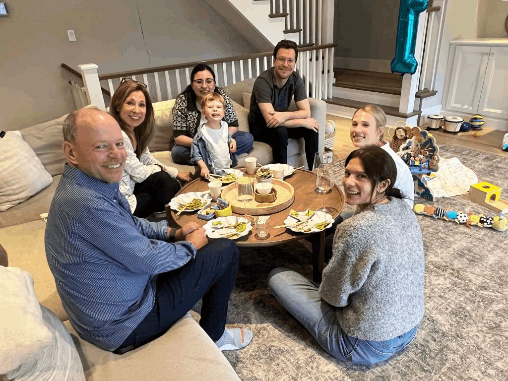 Family gathering around table